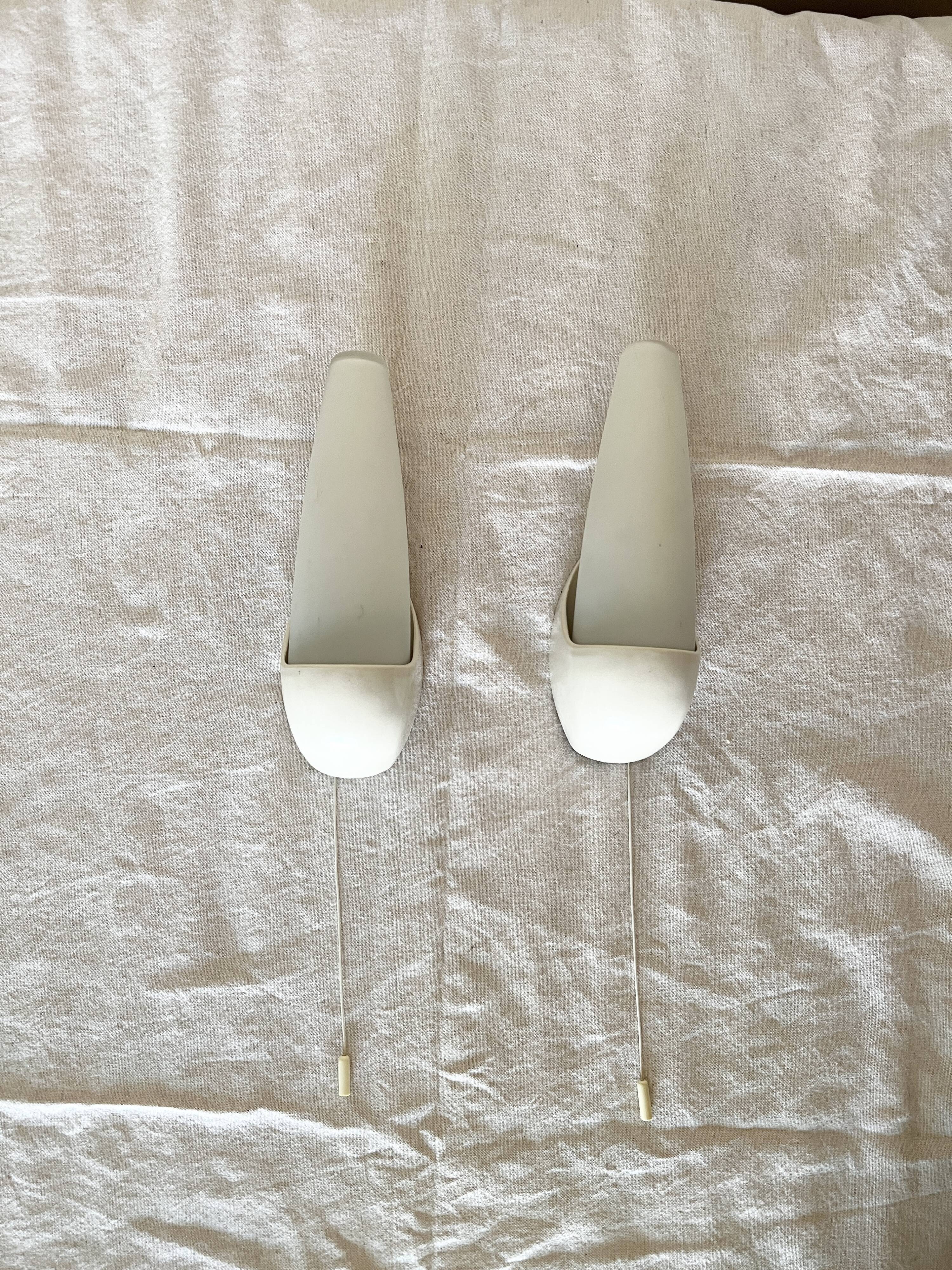 Set of two Small mid-century bakelite & glass wall lamps by Bo Niko Belgium, 1960s