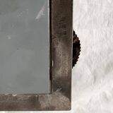 Vintage wall mirror in varnished steel decorated with a rose in relief