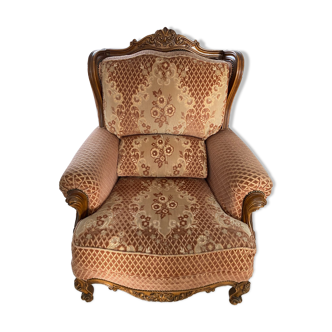 Old armchair in wood and floral fabrics