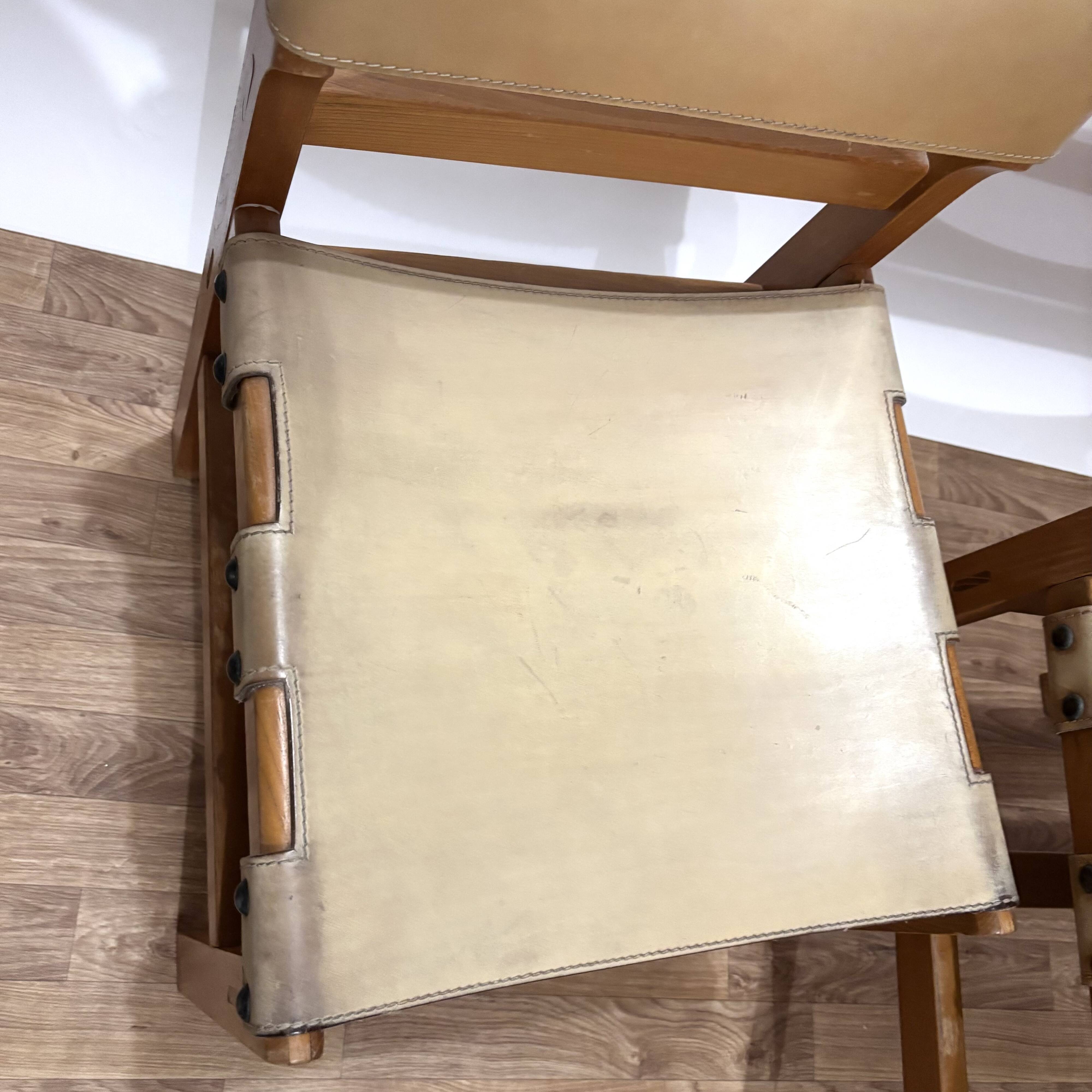 Pair of Maison Regain leather chairs