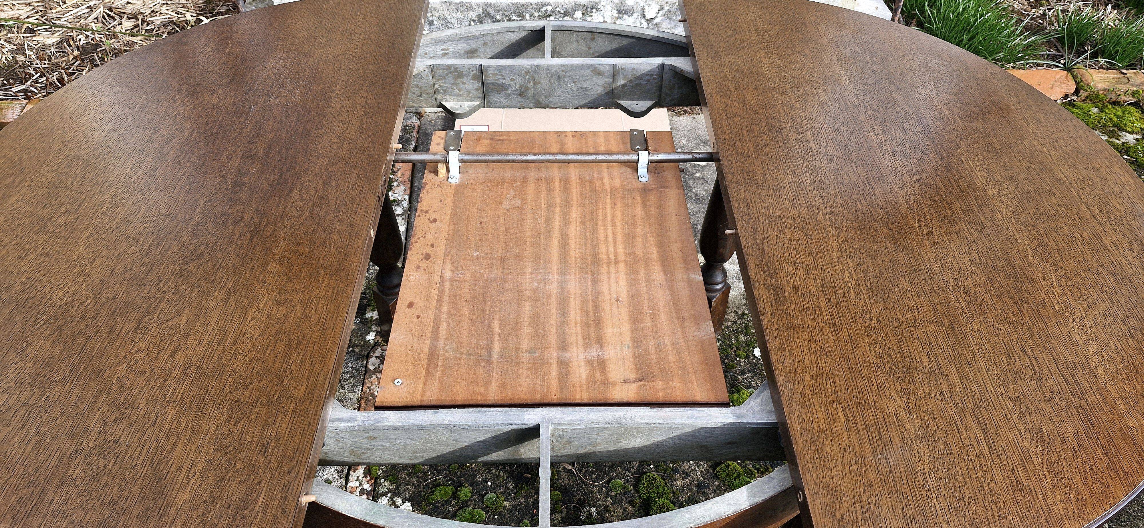 Round wooden table with 1 integrated extension + 6 wooden and fabric chairs