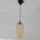 Amber glass suspension light, warm modern interior lighting.