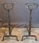 Pair of Landier andirons with buckets, 19th century.