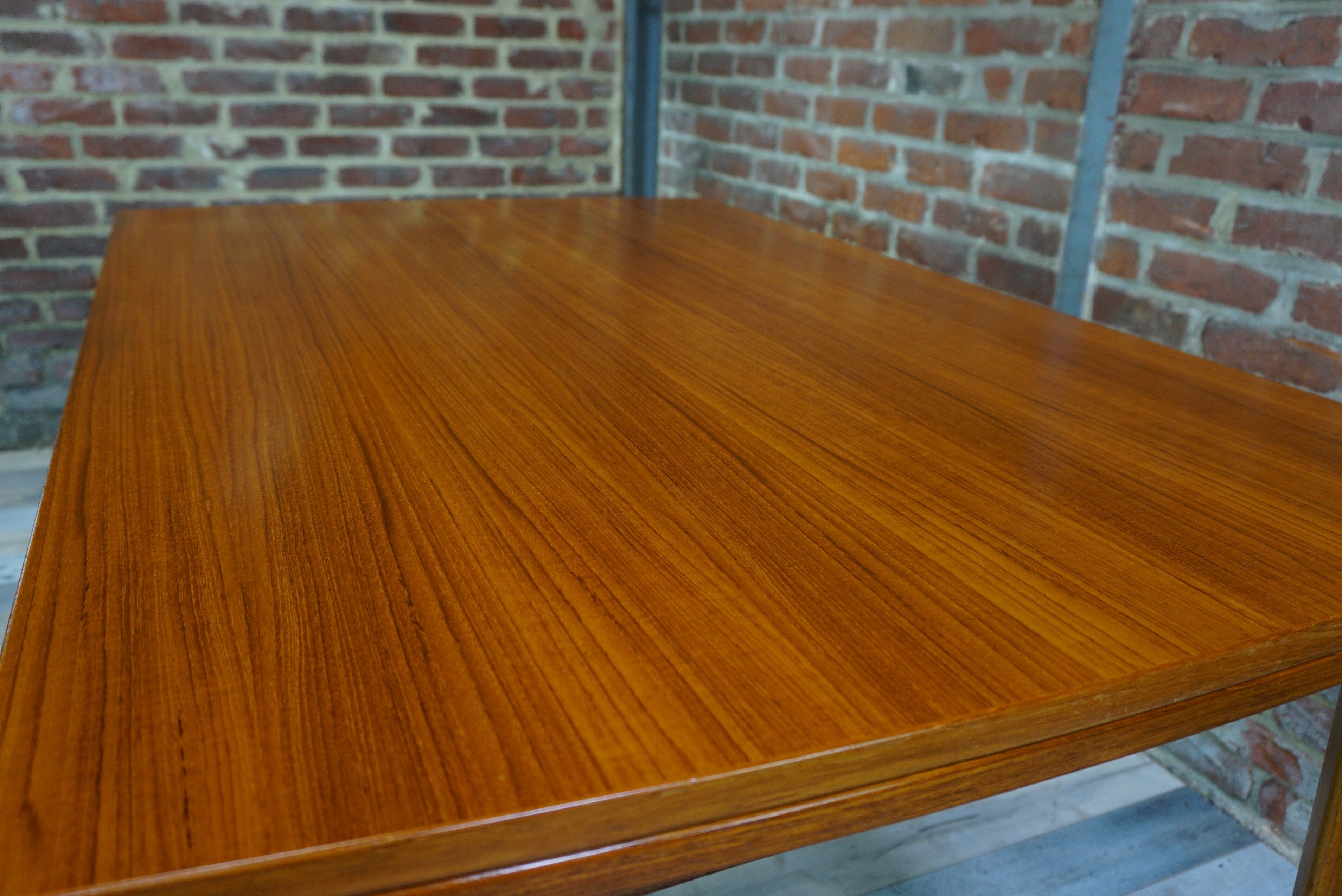 Teak dining table design by Johannes Andersen for Samcom 60s