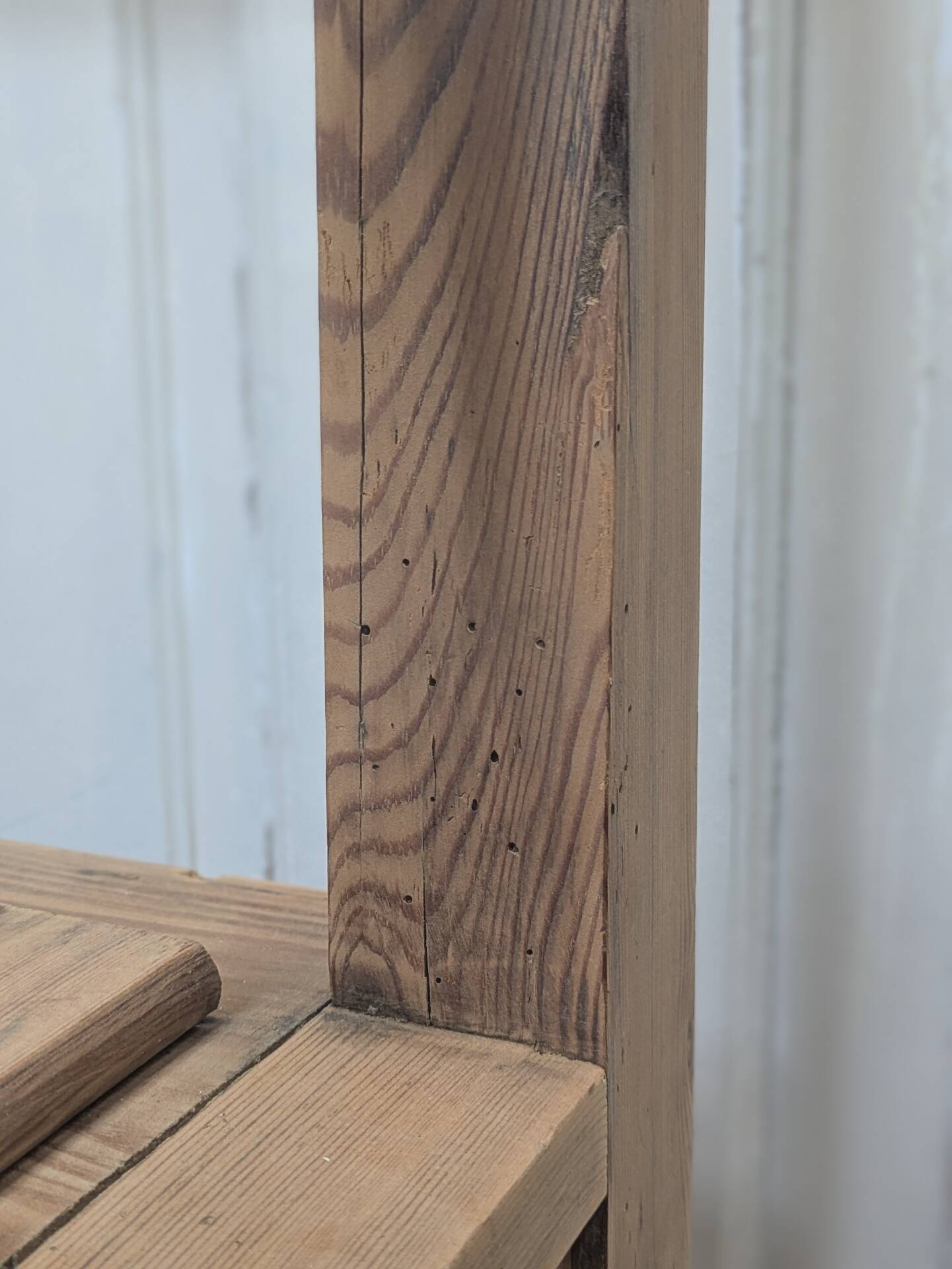 Antique armchair in raw wood