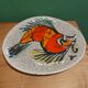 2 vintage ceramic plates with fish decoration