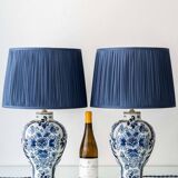 Pair of Royal Delft blue and white ceramic table lamps, 1905, with new pleated silk shades.