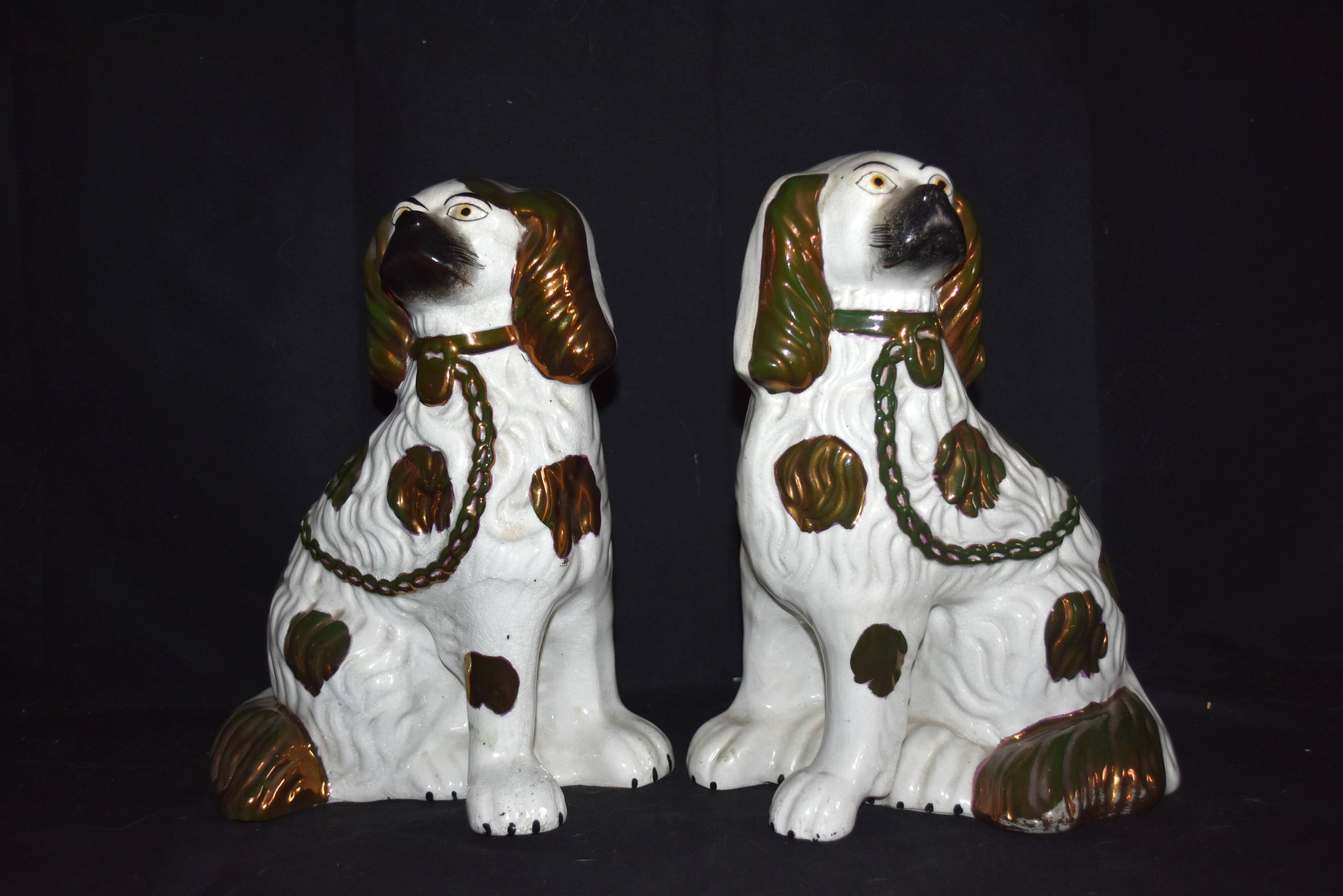 Pair of earthenware dogs (cavalier king charles)