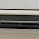 Coat rack in black lacquered metal, perforated sheet metal and brass in the style of Mathieu Matégot