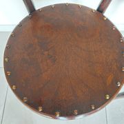 pair of round bistro chairs with a pattern on the seat, vintage