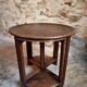 Vintage oak nesting tables set, round coffee table from the 1960s with two integrated side tables.