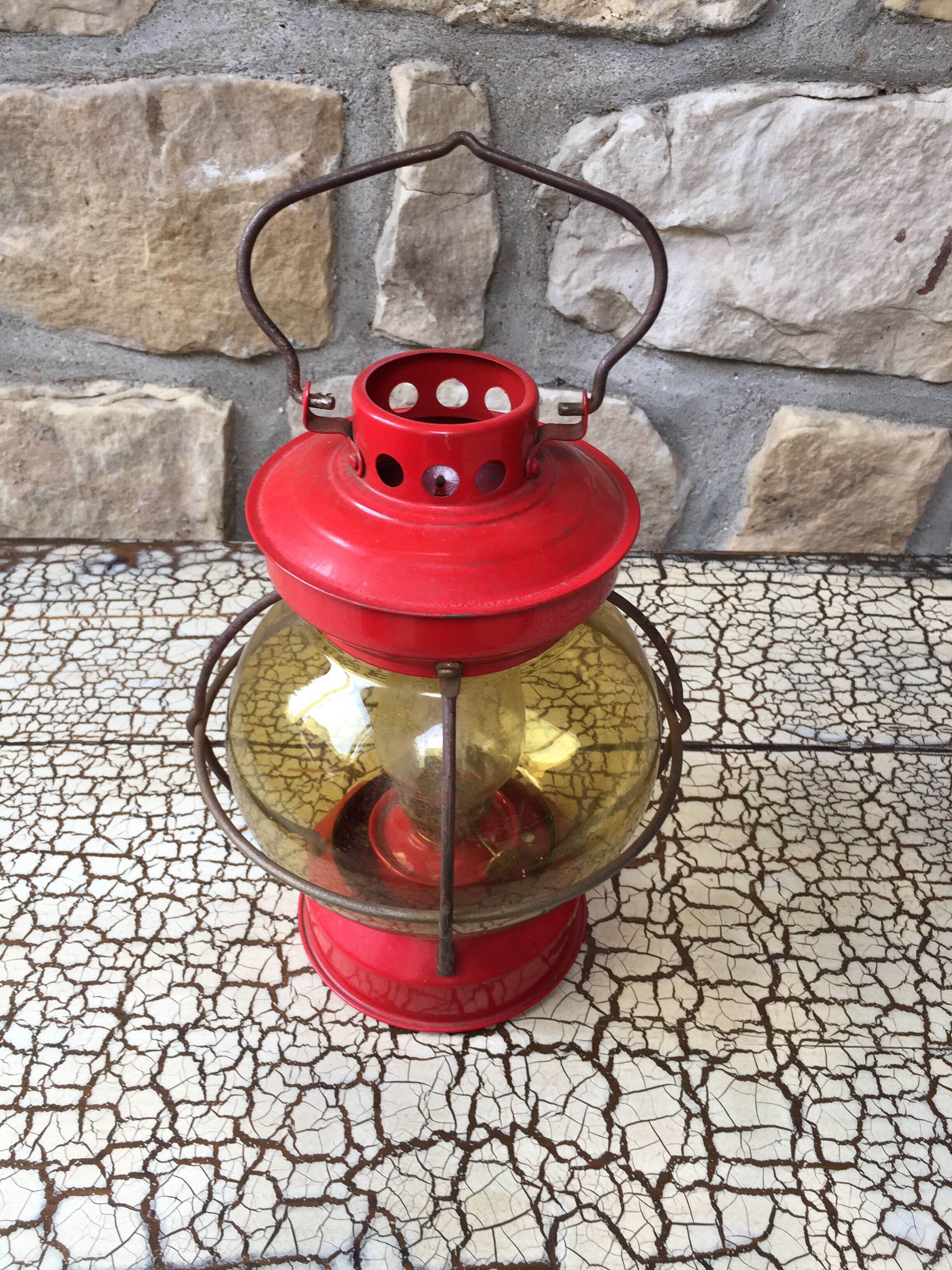 Vintage round glass and metal storm lamp