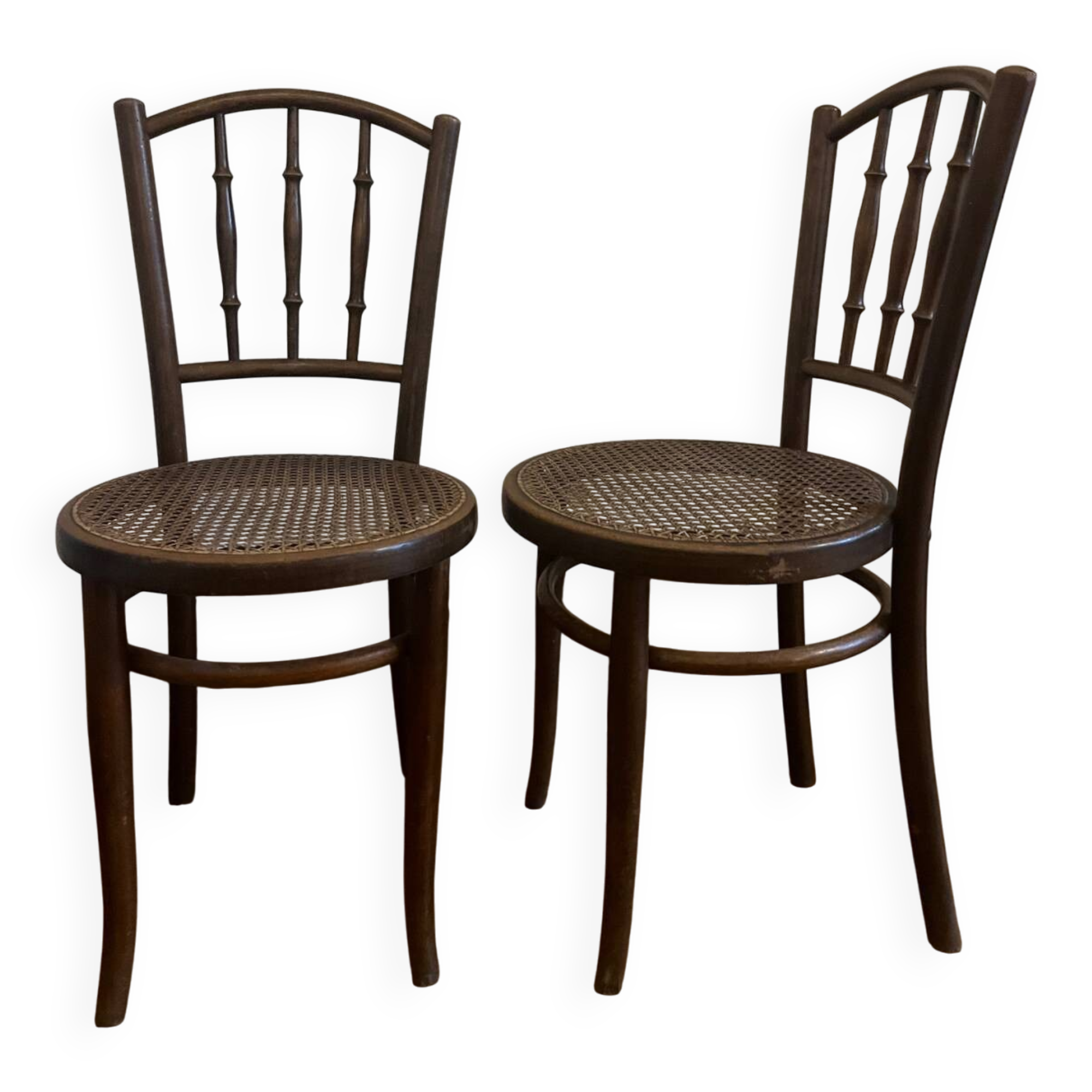 Pair of antique caned bistro chairs stamped Fischel