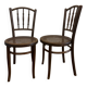 Pair of antique caned bistro chairs stamped Fischel