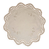 Round embroidered and crocheted doily