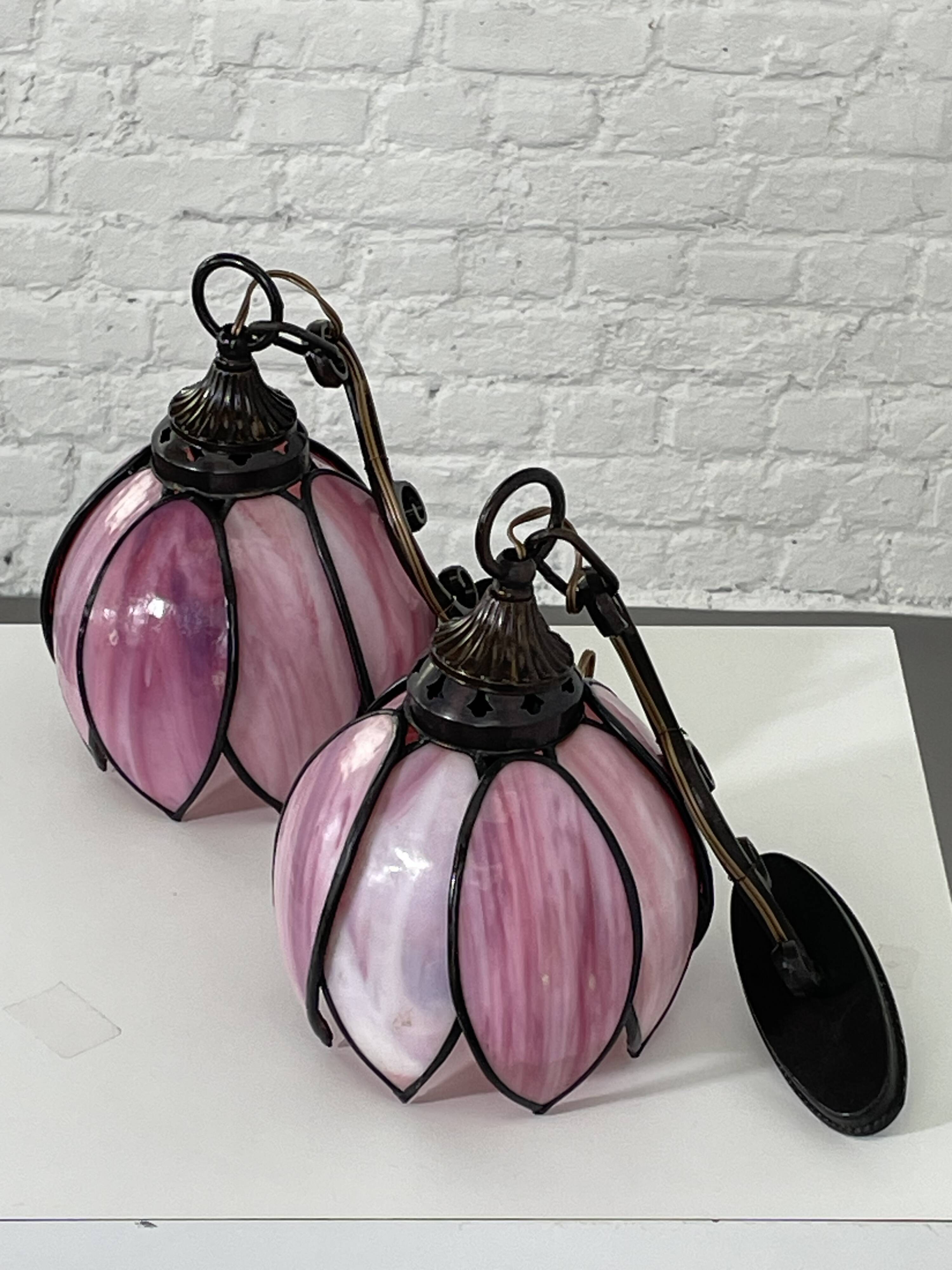 pair of iron wall lamps and Tiffany style glass legs