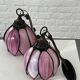 pair of iron wall lamps and Tiffany style glass legs