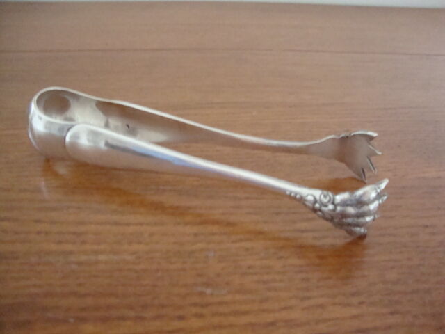 Silver lion's paw sugar clamp (2 punches)