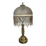Bronze, opaline and tassel table lamp
