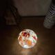 Mosaic glass mushroom lamp in orange, white, and clear.