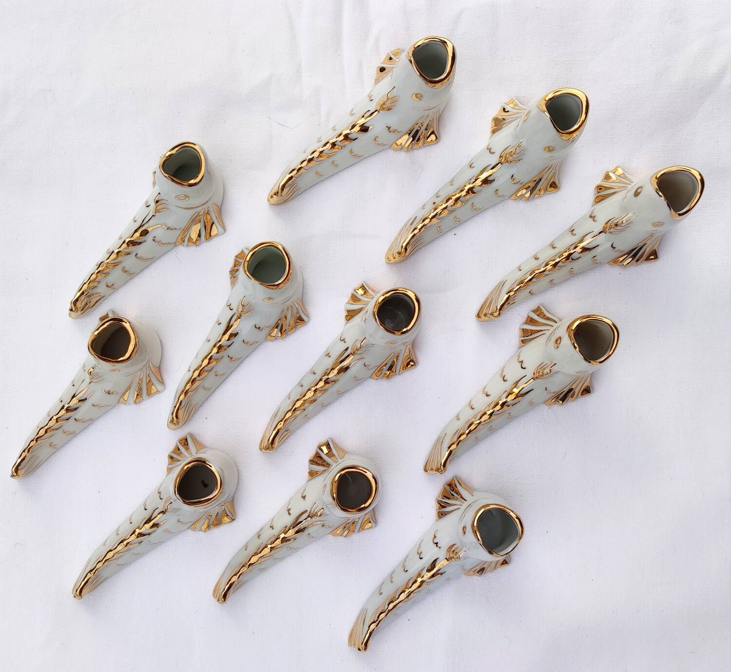 White and gold Limoges porcelain knife rests - animal motif: fish