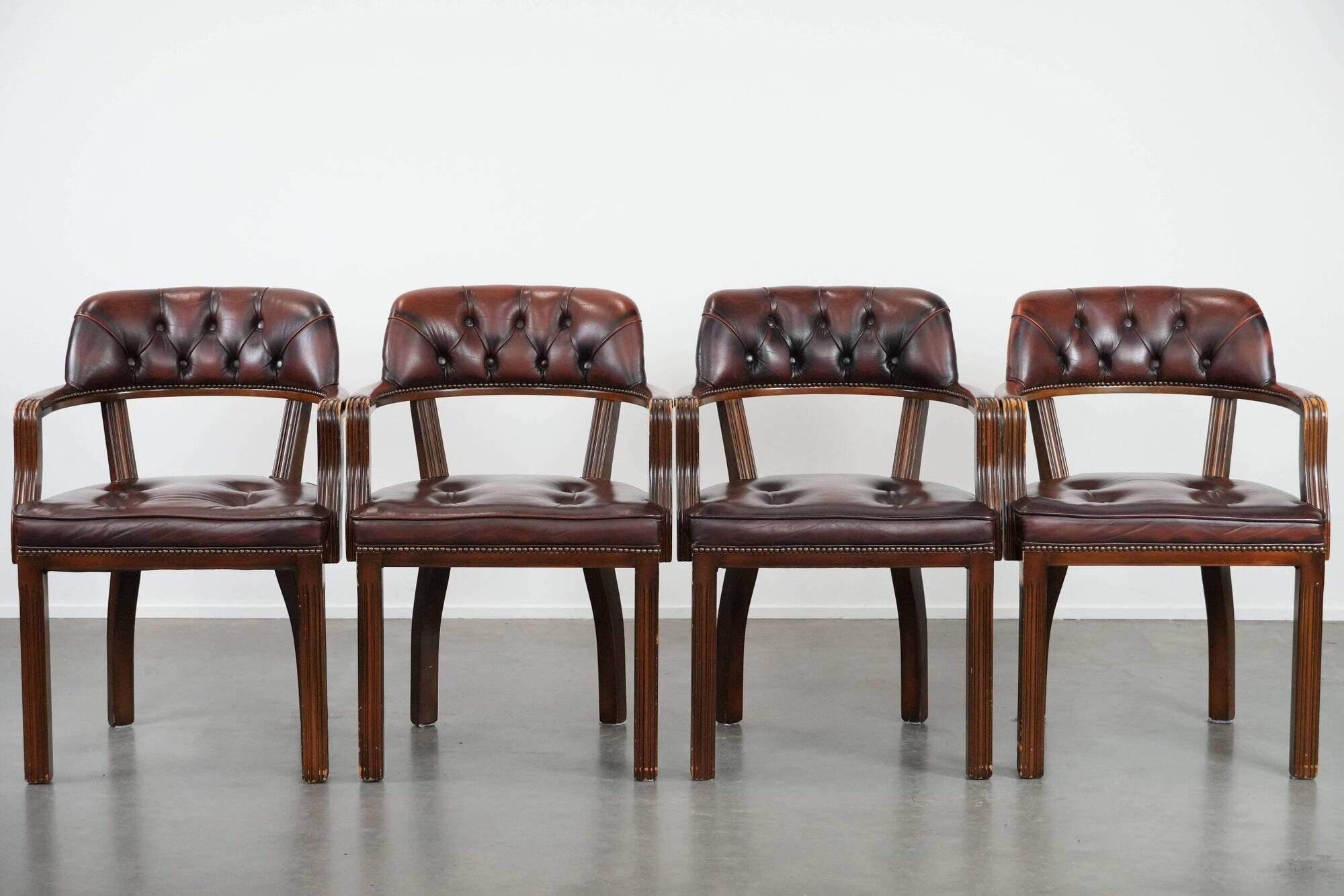 Set of four cowhide leather Chesterfield dining chairs in English style