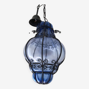Glass suspension in blue cage