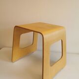 Design stool/side table made of curved plywood.