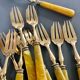 Brass and yellow galathite cake forks