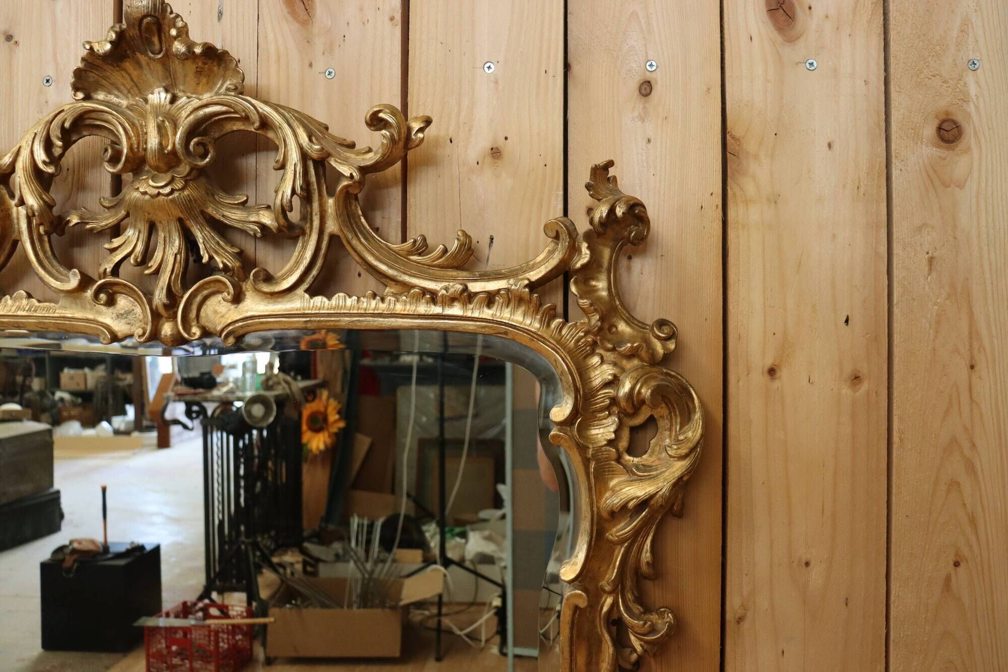 Golden wooden mirror in Louis XV style