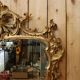 Golden wooden mirror in Louis XV style