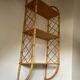 Vintage vertical wall mounted rattan shelf