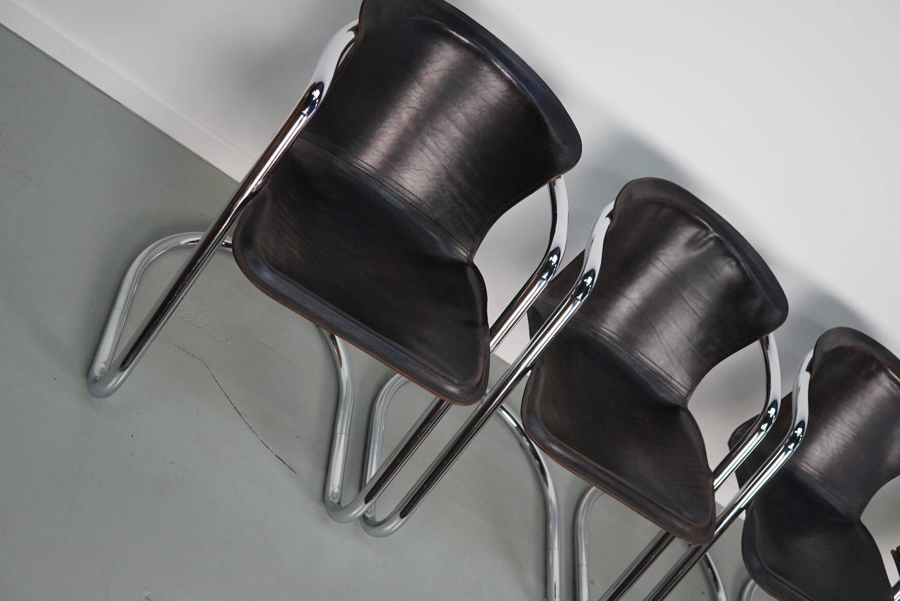 Set of four brown leather dining chairs, Willy Rizzo, 1970