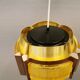 Danish hanging lamp, made in brass colored and brown metal, with yellowish hard pressed plastic deta