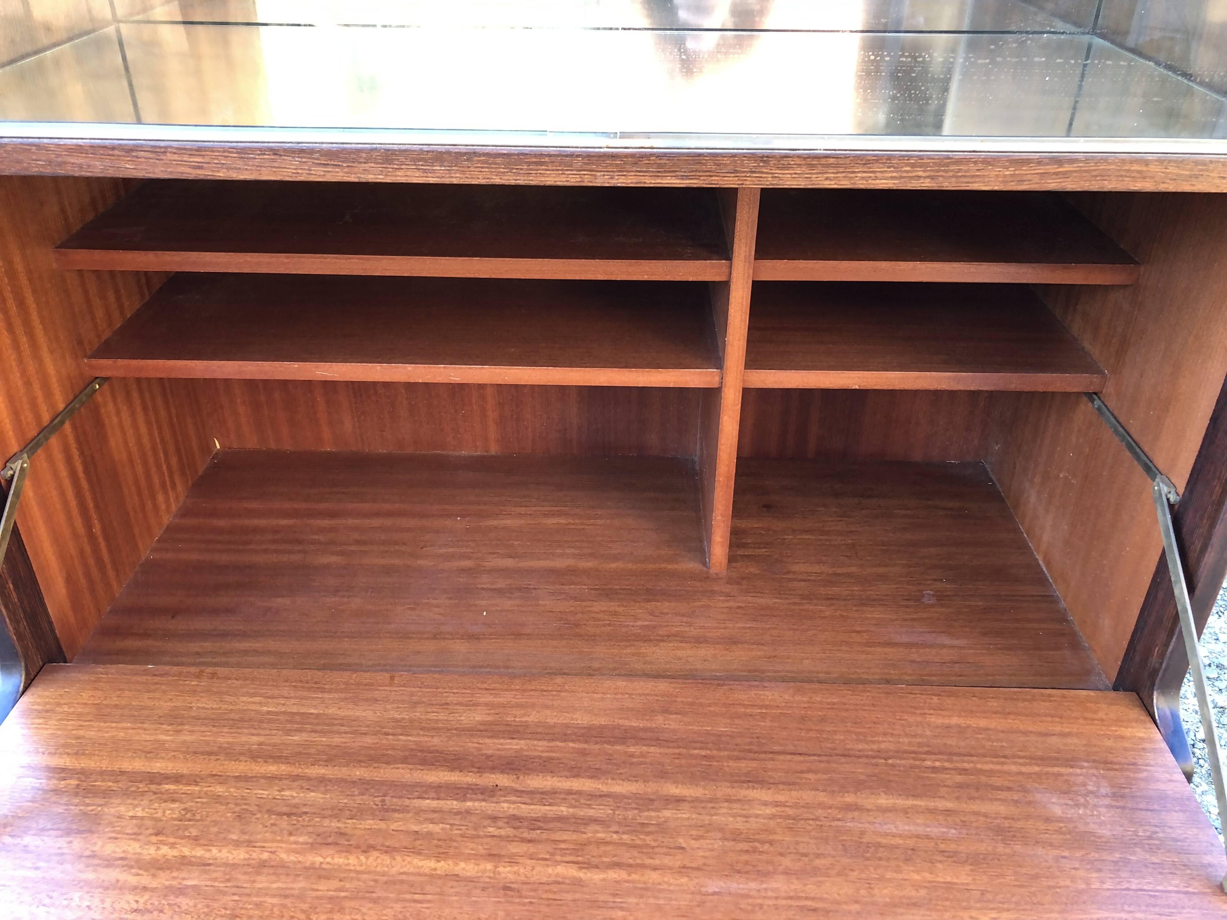 Vintage Scandinavian secretary in rosewood with drawers featuring fin-style handles.