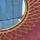 Vintage 1950s sun mirror in gold metal.
