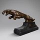 Large Art Deco bronze patinated Jaguar sculpture on an architectural base.
