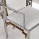 Suite de 6 fauteuils en inox et laiton