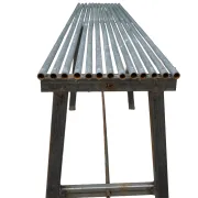 Long metal bench with tubular seat