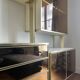 Wall-mounted and modular bookcase in lacquered brass, mirrors and smoked glass by Mahey, Design 1970