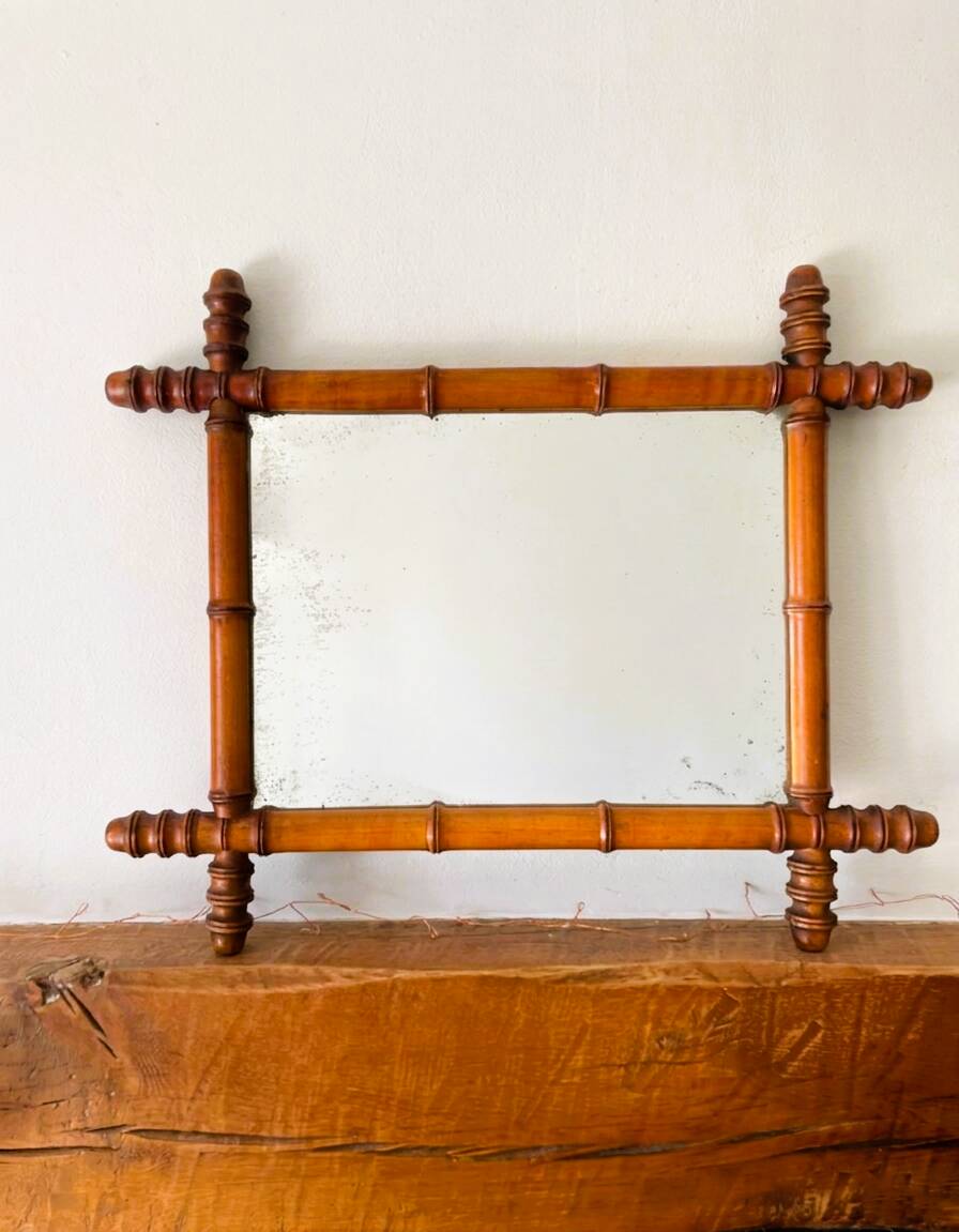Vintage wooden mirror imitating bamboo