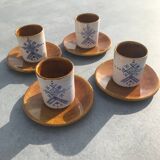 4 ceramic cups and saucers