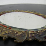 Hand-facing mirror in gilded bronze