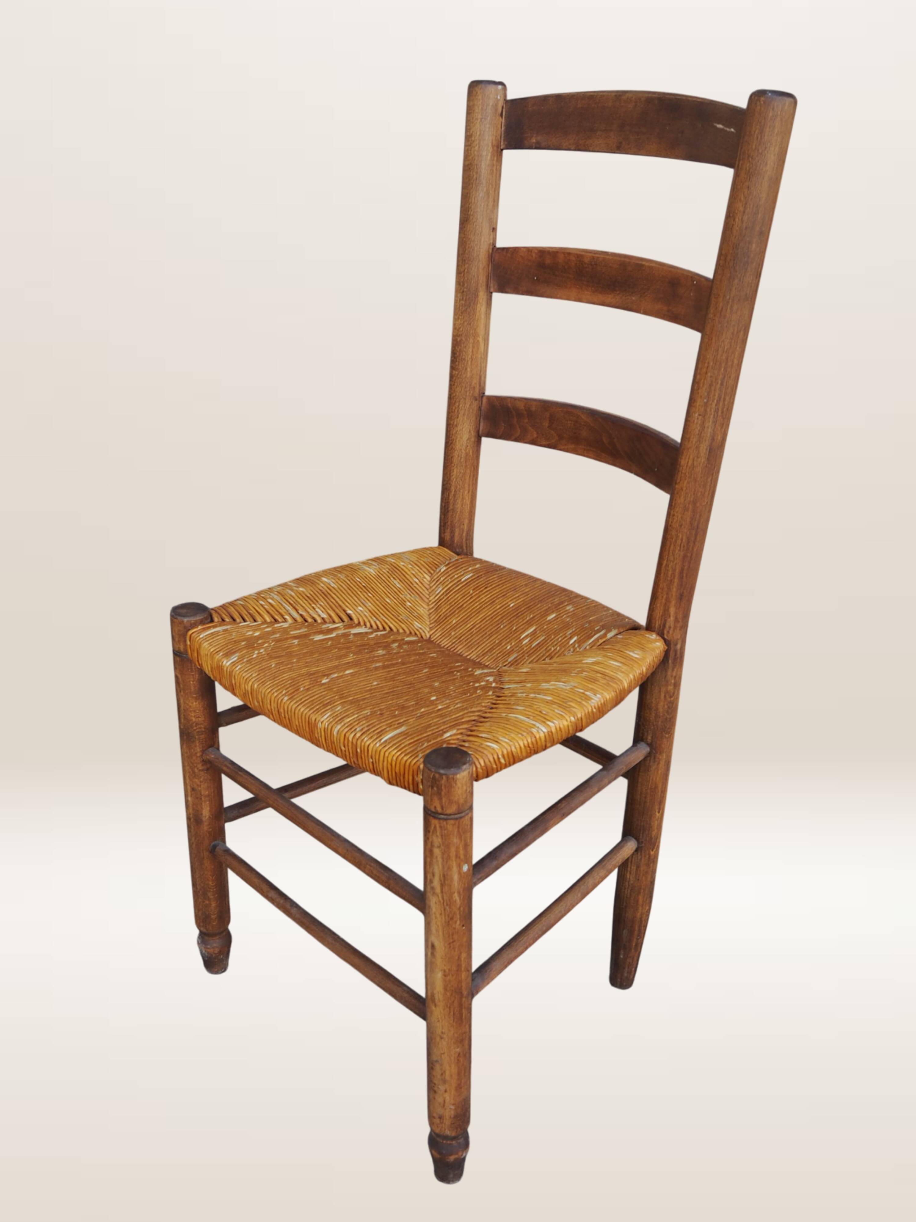 Set of six rush-seated ladderback chairs.