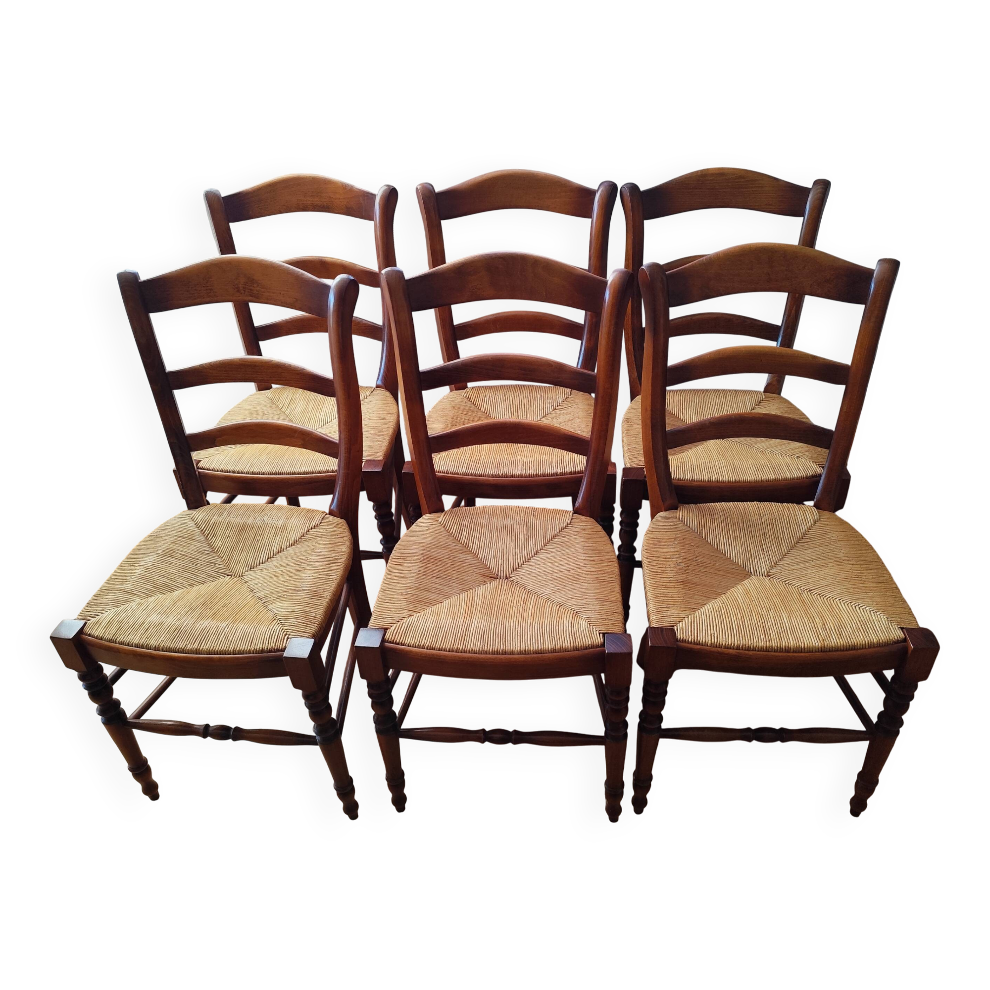 Set of 6 solid wood chairs with high-quality straw seats.