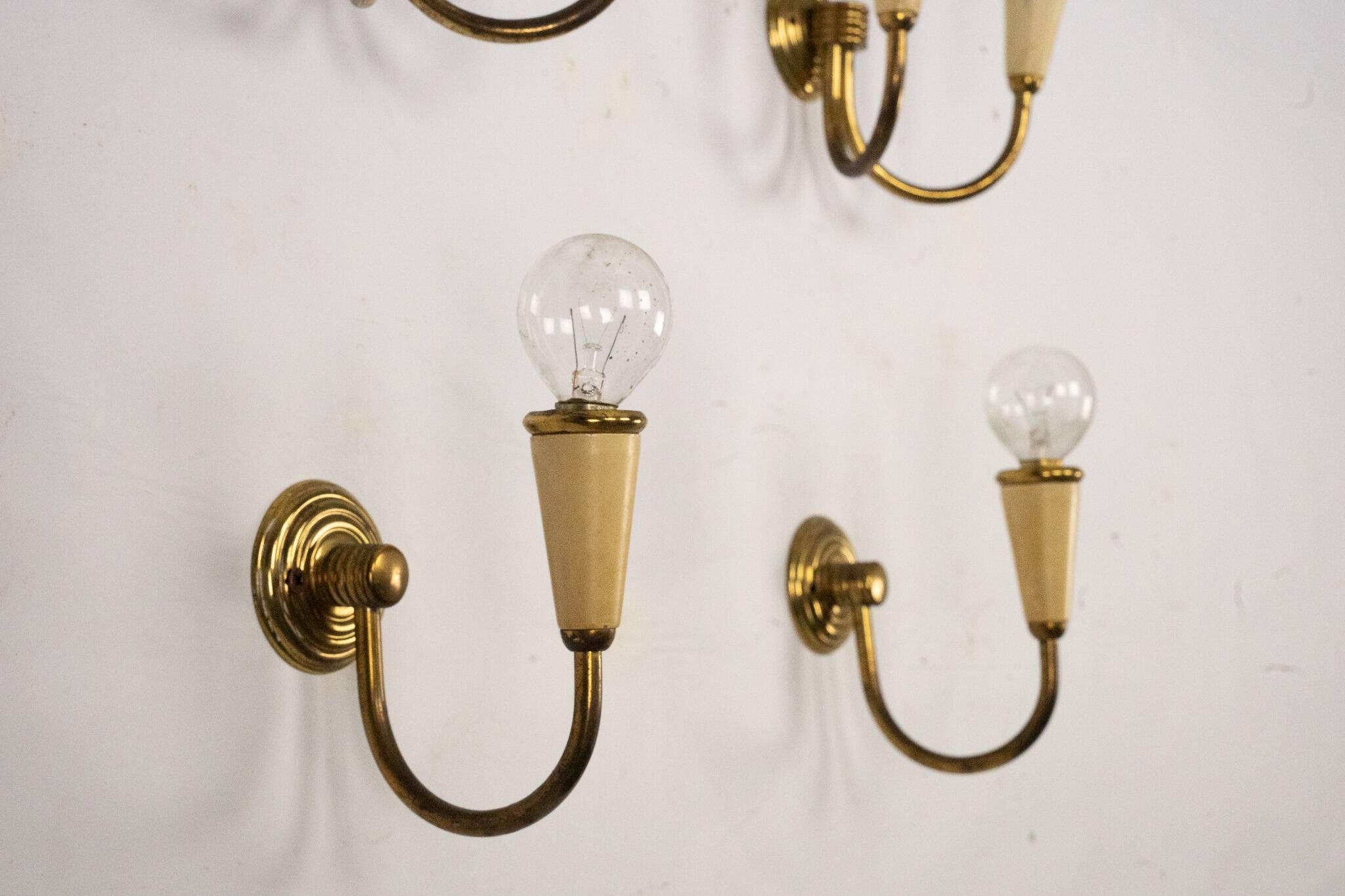 Set of four Mid-Century sconces in lacquer and brass. Italy 1950s