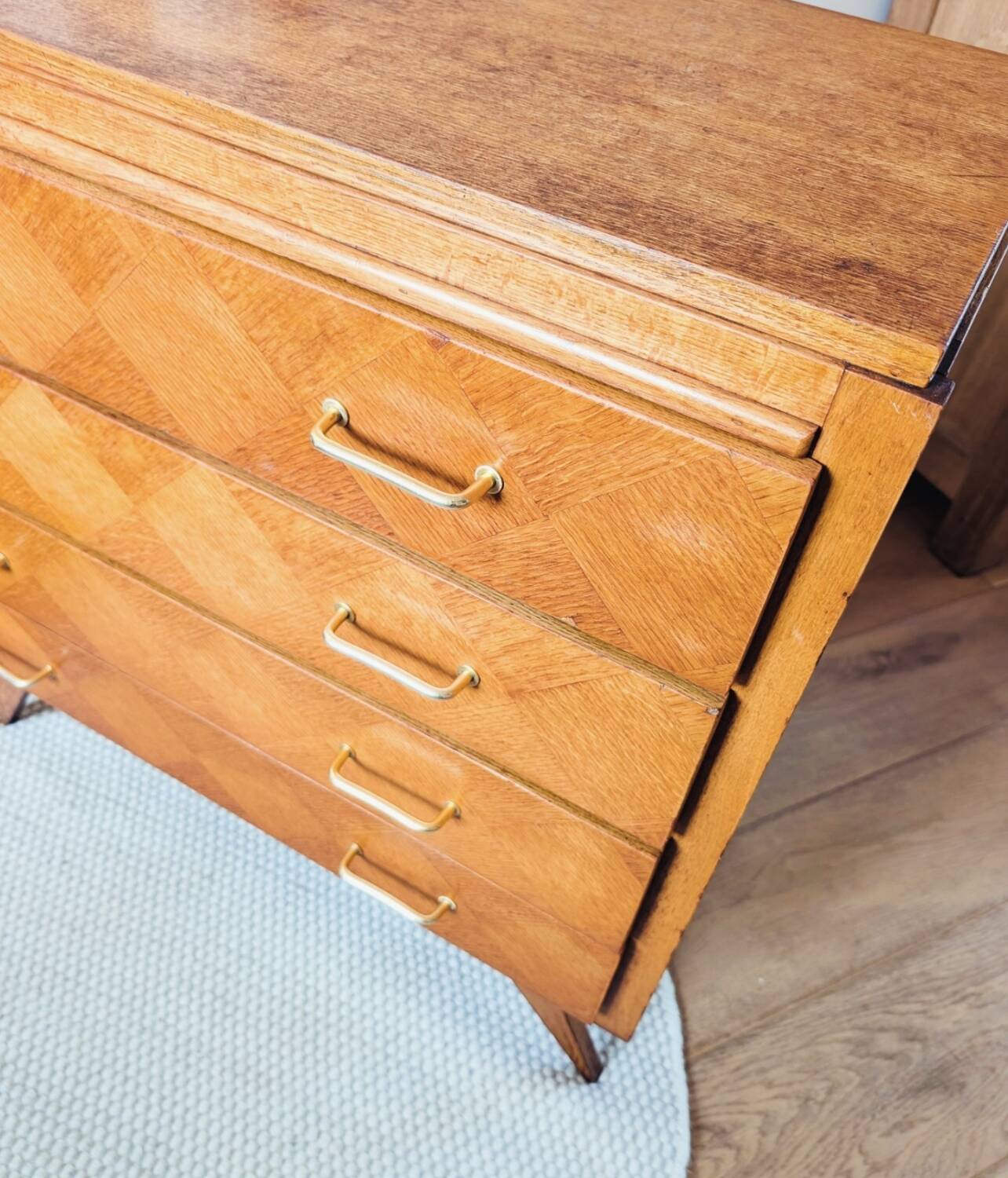 Vintage chest of drawers with checkerboard and compass feet