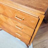 Vintage chest of drawers with checkerboard and compass feet