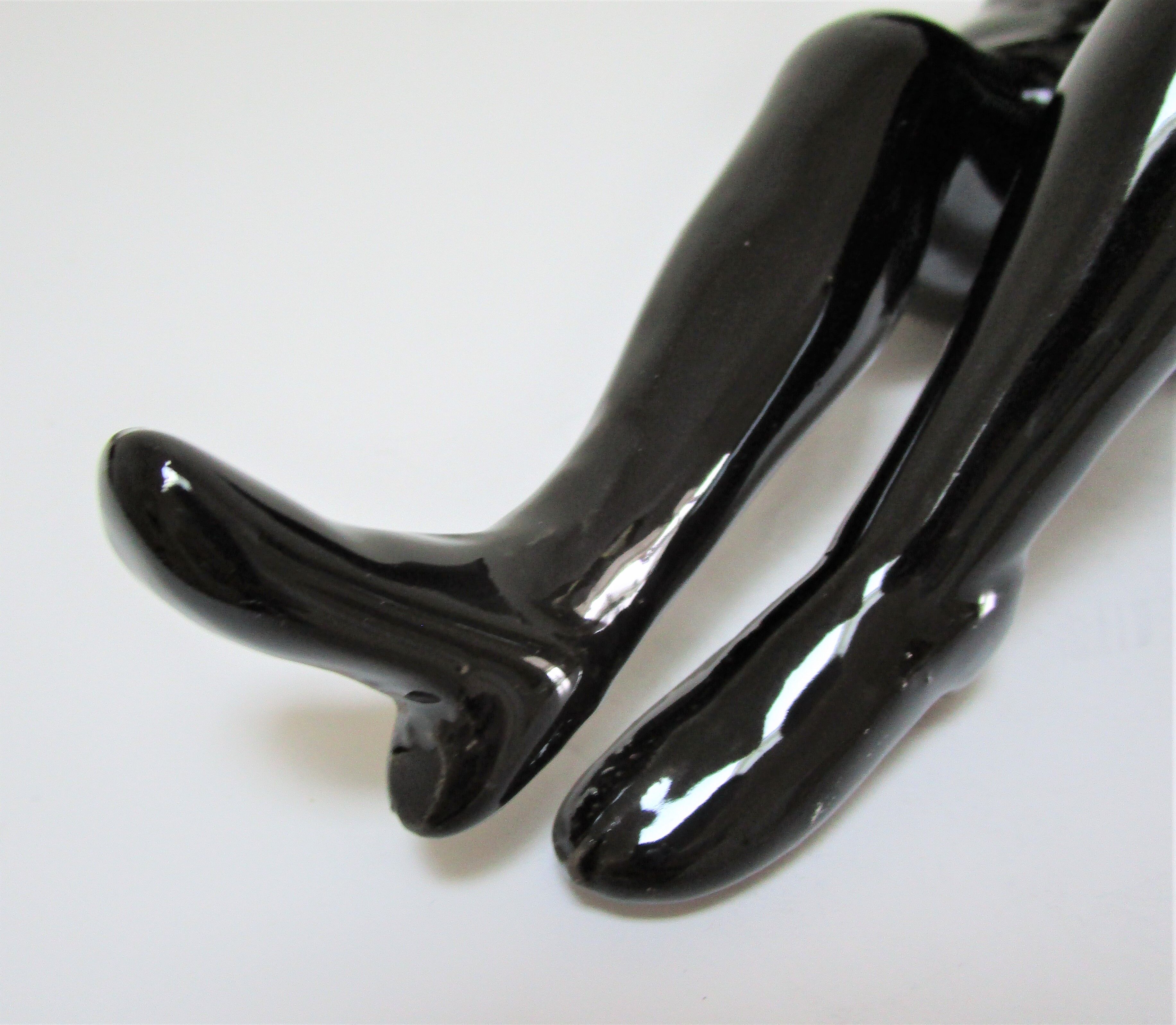 Anthropomorphic ashtray legs ceramic black design 80s
