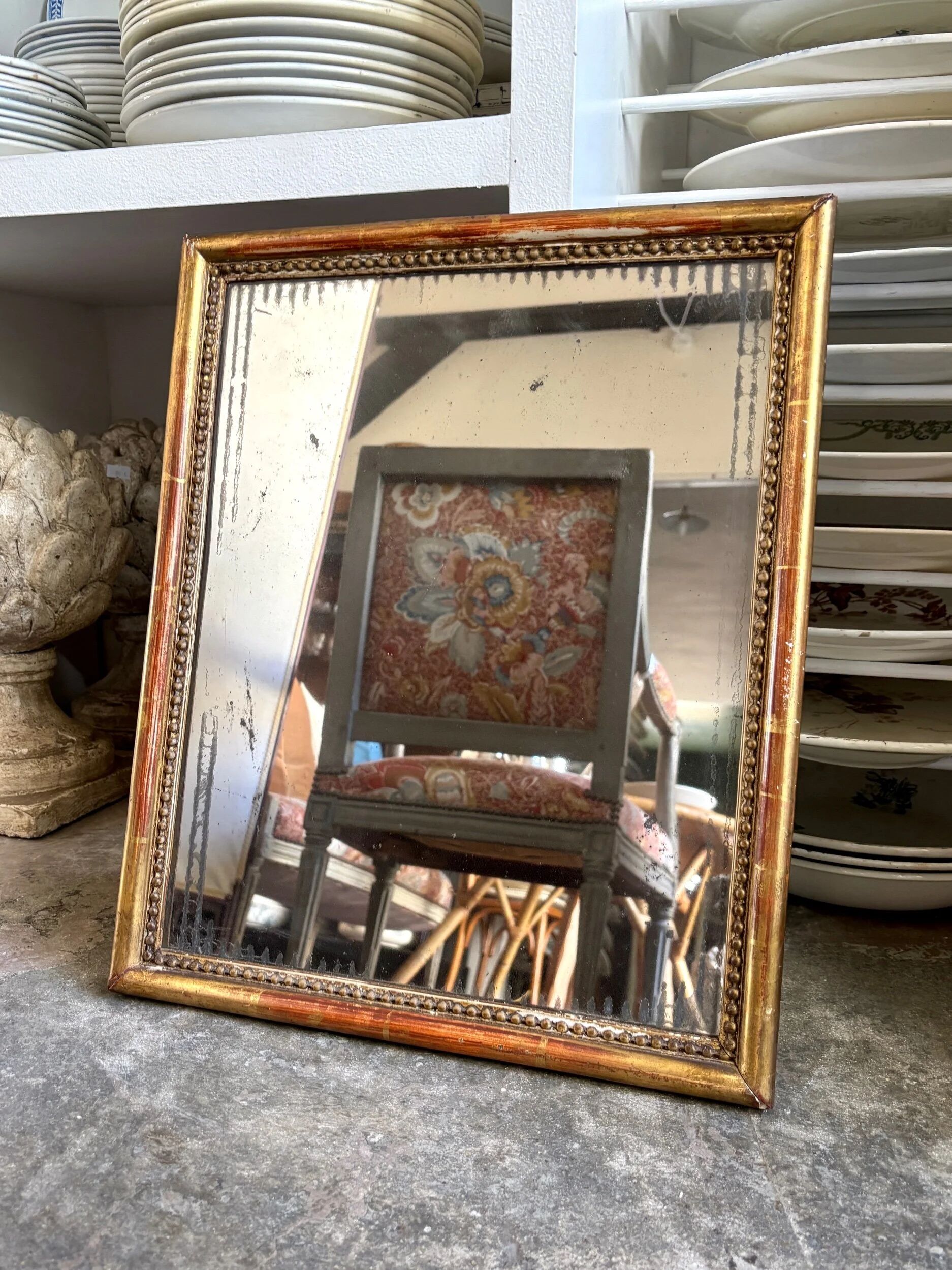 Wooden mirror with gilded stucco and beaded frieze, 45 x 37 cm